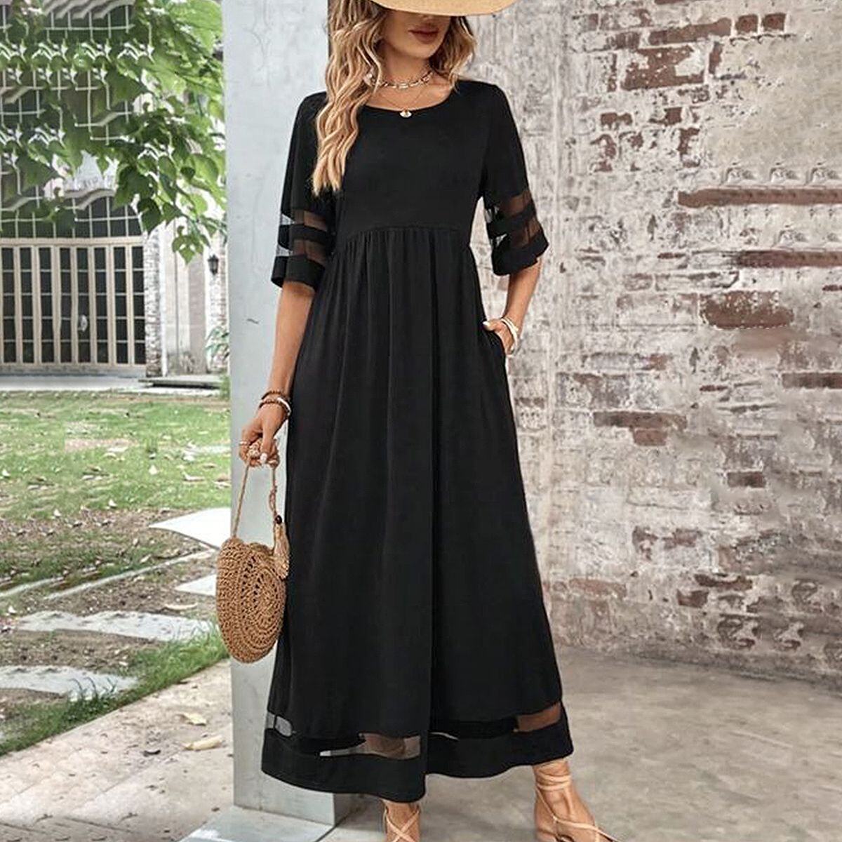 Um ótimo vestido maxi preto simples com mangas 3/4